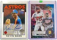 Front view of both cards inside top-loaders