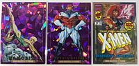 Front view of all three holographic cards displaying characters and foil pattern