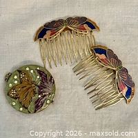 Compact and two butterfly hair combs overview