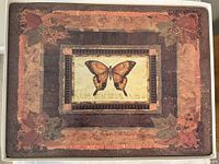 Boxed view of stacked butterfly placemats