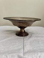 Side profile of sterling pedestal dish showing height and form