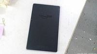 Rear view of black Amazon Fire tablet showing Amazon logo