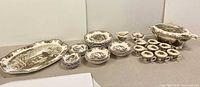Full lot showing platter, stacks of plates, bowls, cups and soup tureen