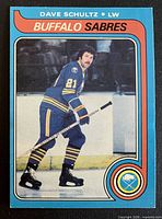 Front of 1979-80 O-Pee-Chee Dave Schultz card showing player in Sabres uniform
