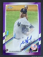 Front view of Miguel Yajure 2021 Topps Chrome Purple refractor rookie autograph card with blue ink signature