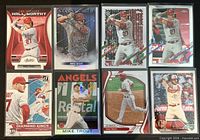 Fronts of eight Mike Trout baseball cards in sleeves