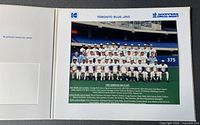 Interior view of folder displaying the 1989 Toronto Blue Jays colour team photo with printed roster