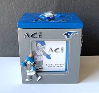 Front view showing ACE mascot, photo window and lettering