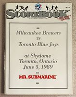 Front cover of the 1989 Skydome inaugural game scorebook showing title, teams, date and location