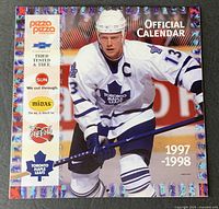 Front cover showing player, sponsor logos, year 1997-1998