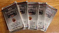 Five sealed 1992-93 Upper Deck NBA Basketball card packs displayed fan-style