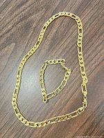 Necklace and bracelet laid out to show full length and link style
