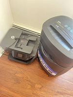 HP OfficeJet printer beside Royal shredder, showing overall condition