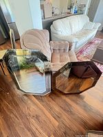 Two large octagonal mirrors and small rectangular mirror on floor