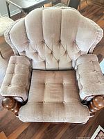 Top view showing tufted back, seat, and arm design