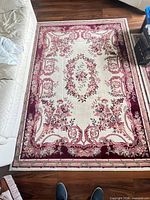 Full view of larger 5x6 ft rug showing pattern, colors and overall condition