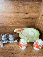 Entire lot showing lobster motif ceramic set and metal owl shakers