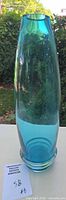 Full view of turquoise glass vase