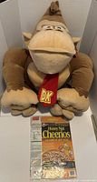 Large Donkey Kong plush seated with Cheerios promo box displayed
