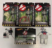 Front view showing three sealed Diamond Select figures, Hot Wheels card, loose mini figure and Stay Puft figure