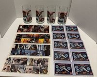 Full view of lot with 4 glasses, 4 panorama strips, 10 scratch cards
