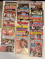 Front covers of 20 bagged wrestling magazines