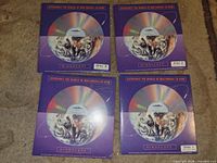 Front view of four sealed Mindscape CD-ROM discs showing artwork and disc numbers