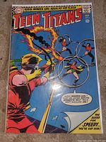 Front cover of Teen Titans #4 in bag and board