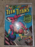 Front cover of Teen Titans #5 in bag and board