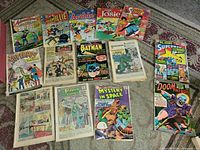 Group shot of all comics spread out showing covers and interior pages