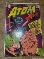 Front cover of The Atom #26 sealed in bag