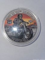 Obverse side of Route 66 100th Anniversary medallion in capsule