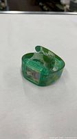 Top view of translucent green Krusty the Clown digital watch