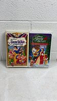 Front view of both VHS tapes in clamshell cases