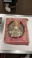 Front view of boxed Honey Doll showing doll and packaging