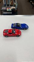 Top view of both model cars showing colors and scale
