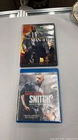 Front view of both movie cases closed