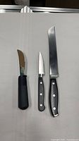 All three knives side by side on flat surface