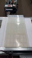 Three clear plastic boxes closed, showing overall size and translucency