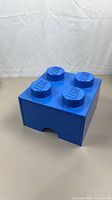 Front and top view of blue 4-stud LEGO storage drawer