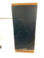 Front view of speaker showing grille and Marantz badge