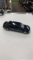 Left side view showing full limousine body and decals