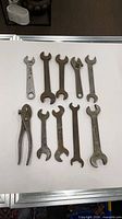 All ten tools laid flat to show count, type and condition
