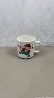 Front view of white ceramic mug with Pinocchio graphic