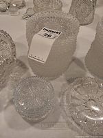 Group showing hobnail vase, lidded jar, round bowl, faceted vase and other pieces