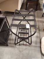 View of luggage rack folded out, showing metal frame and top straps