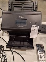 Front view of Brother ImageCenter ADS-2800W scanner with display and output tray