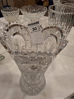 Front view of the clear cut crystal vase showing starburst cuts and flared scalloped rim
