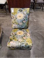 Front view of floral slipper chair