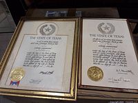 Two framed State of Texas commission certificates with gold seals and gilt frames